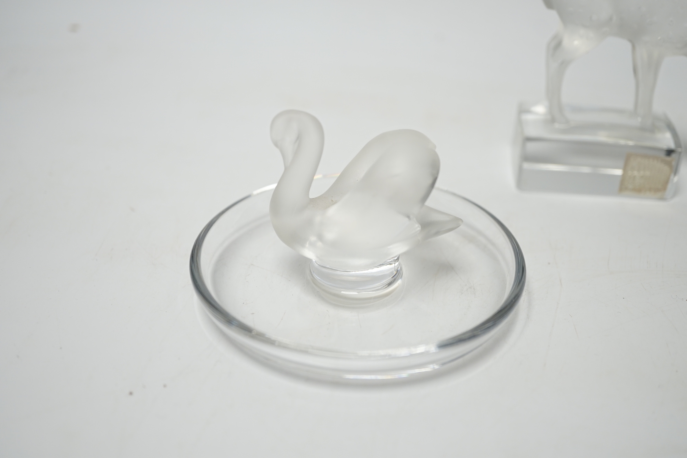 Rene Lalique - two glass pin dishes modelled as a swan and a fish together with a paperweight modelled as a giraffe, signed ‘Lalique France’ to base, tallest 9.5cm high (3)